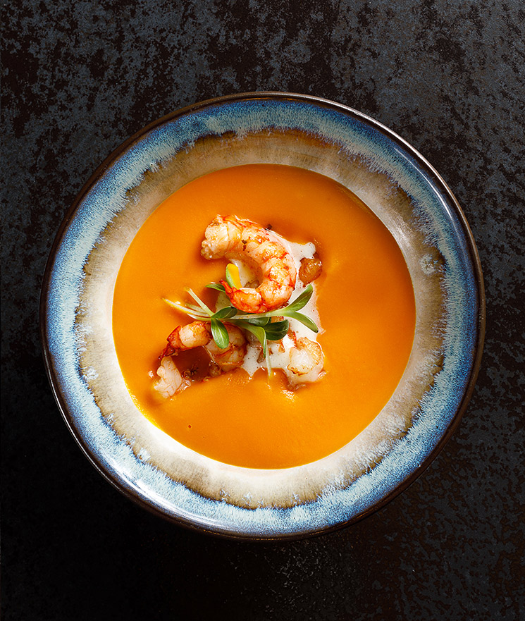 Pumpkin cream soup with tiger prawns and mascarpone